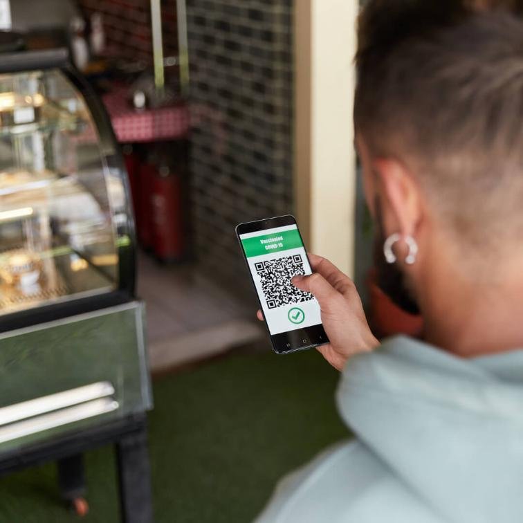 person paying at a bakery shop using qr codes